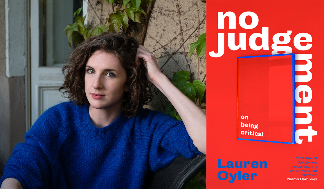 Lauren Oyler sits outdoors wearing a bright blue jumper. Lauren has shoulder length brown hair.