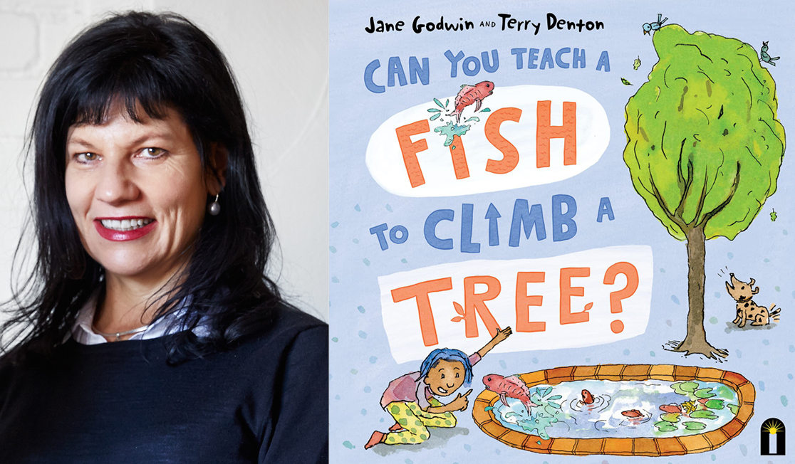 Jane Godwin has long black hair and a fringe. Jane is smiling.