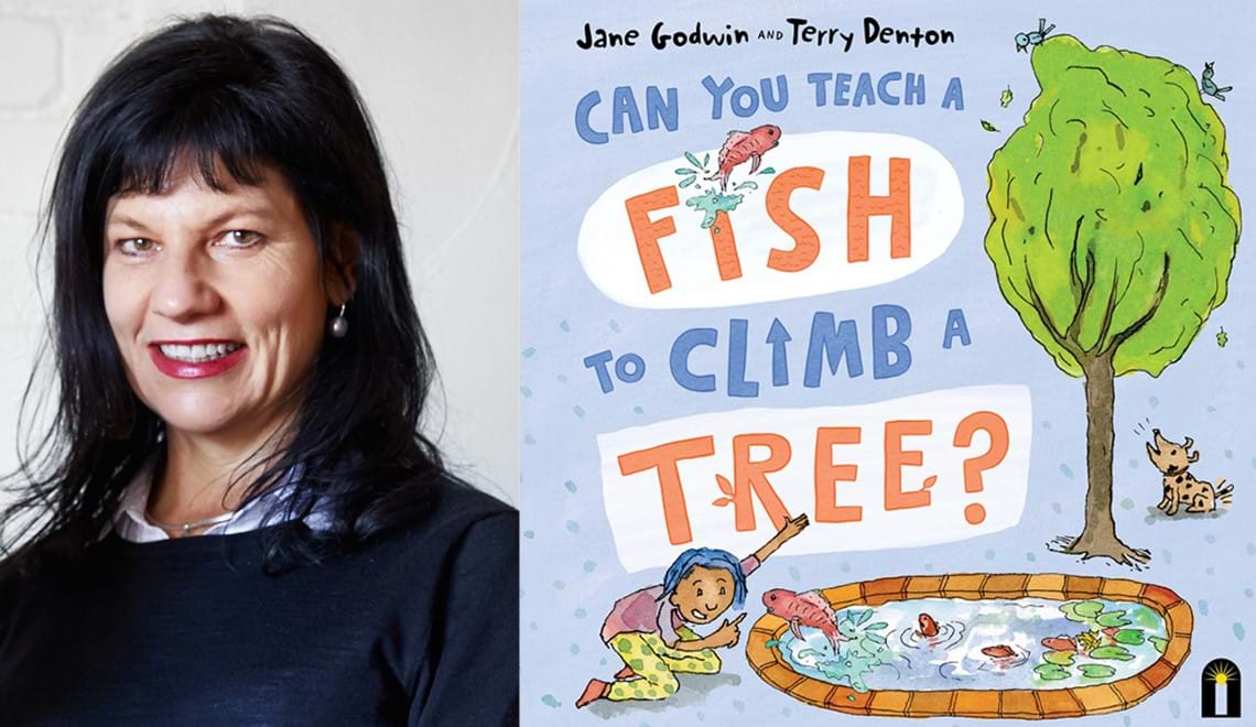Jane Godwin has long black hair and a fringe. Jane is smiling.