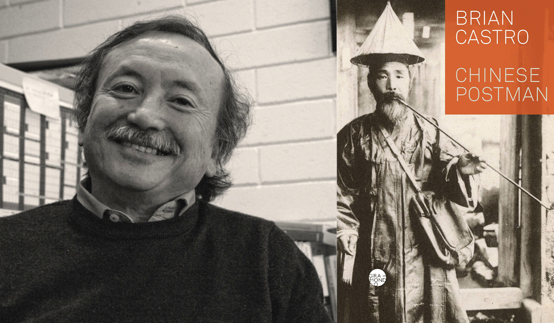 Brian Castro wears a dark jumper with a collared shirt. Brian has short hair and a moustache and is smiling.