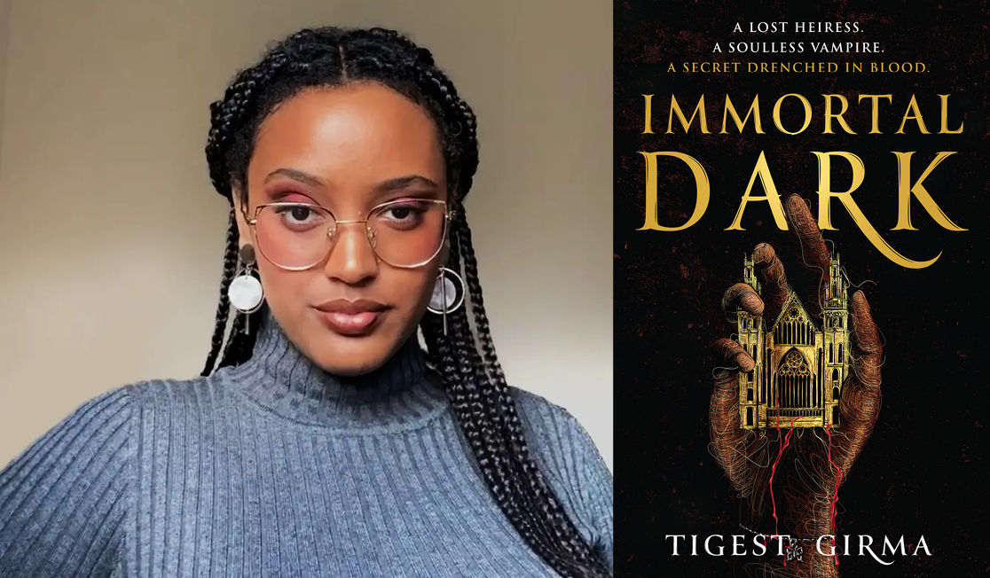 Tigest Girma wears a grey top, fancy round earrings and metallic framed glasses. Tigest has long dark braided hair and pink eyeshadow.