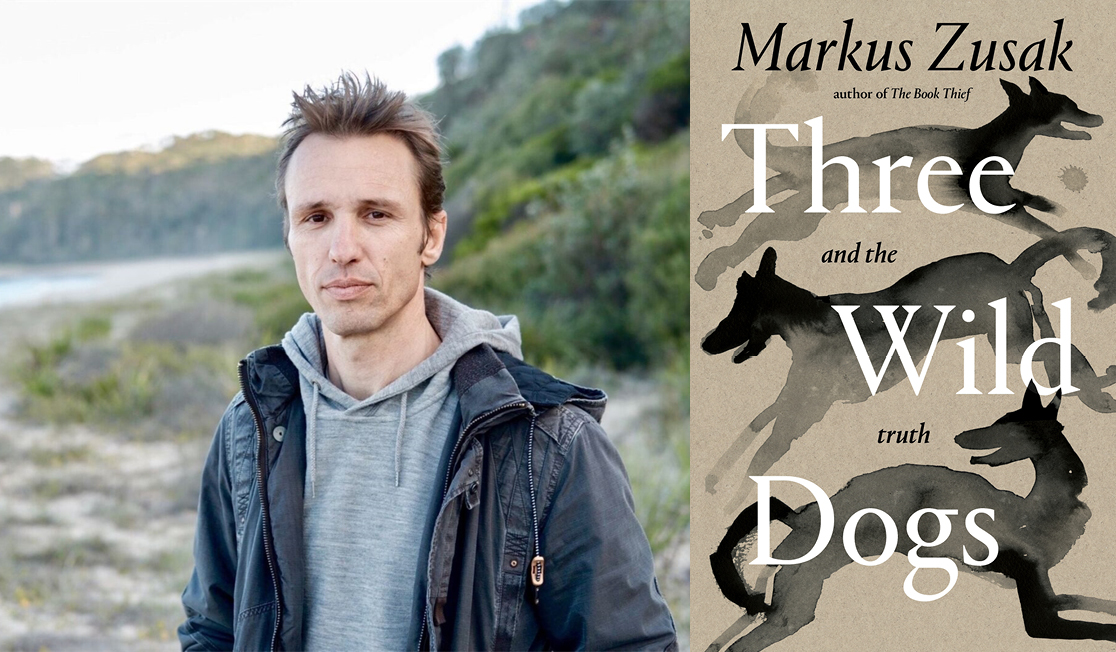 Markus Zusak stands outdoors in front of a coastal landscape. He wears a black jacket over a grey hoodie. Markus has short brown hair and has a serious expression. The book jacket has an illustration of three black dogs.