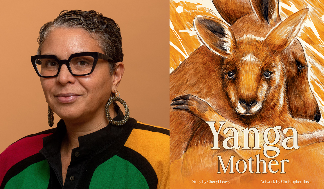 Cheryl Leavy wears a multicoloured jacket. Cheryl has glasses with dark frames and wears big round earrings. 