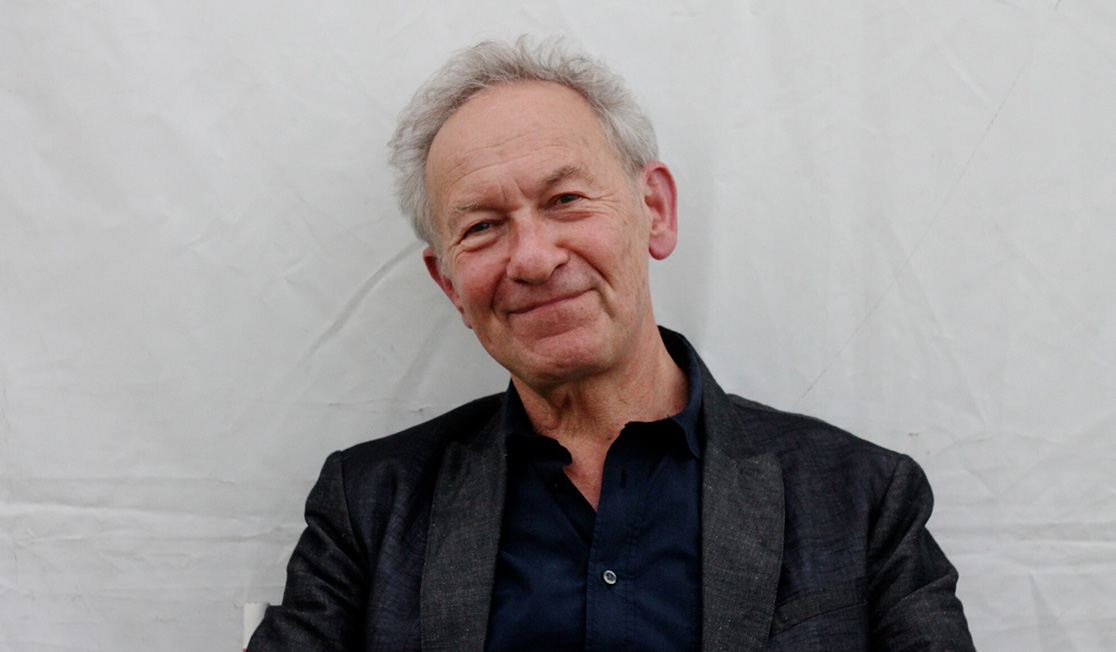 Portrait of a smiling Simon Schama